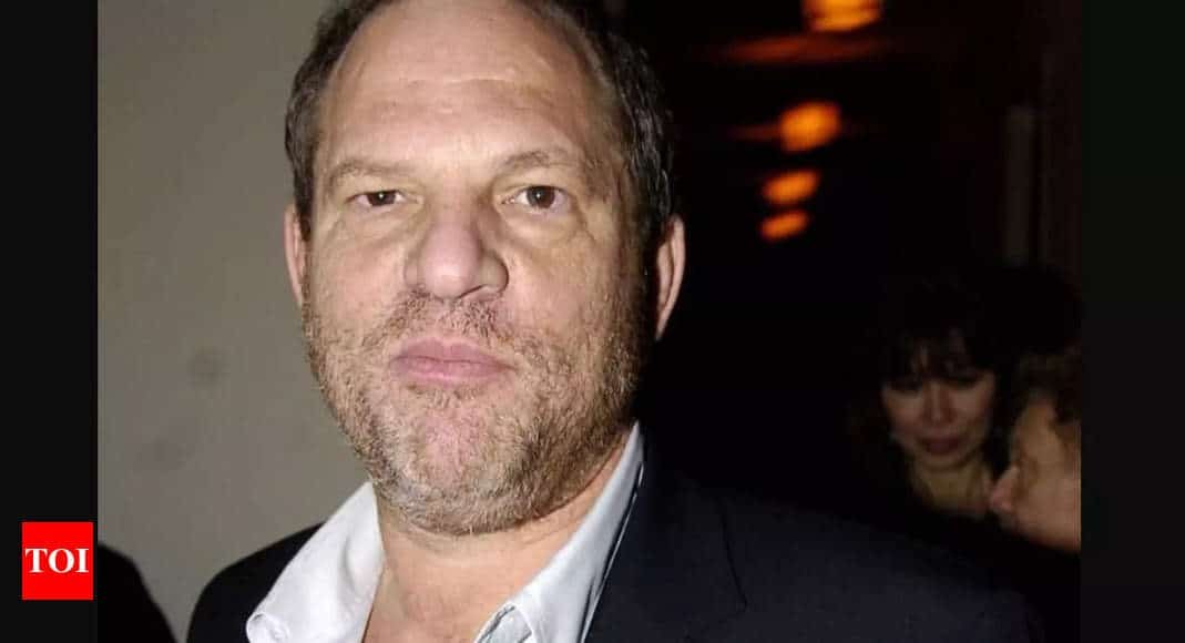 Harvey Weinstein makes courtroom return in handcuffs as retrial in rape conviction begins | - Times of India