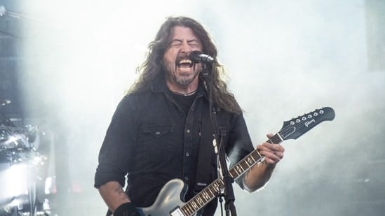 US musician Dave Grohl of rock band Foo Fighters performs on the Orange Stage at Roskilde Festival on July 5, 2024 in Roskilde, Denmark. (Photo by Helle Arensbak / Ritzau Scanpix / AFP) / Denmark OUT(AFP)