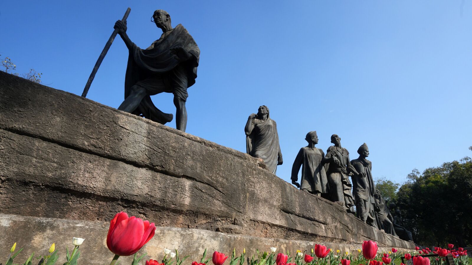 Dandi March: PM Modi hails Mahatma Gandhi’s historic movement — ‘inspires generations’ | Today News 4 Tulips bloom at the Dandi March Statue, commonly known as Gyarah Murti, as part of the �Delhi Tulip Festival� organised by the New Delhi Municipal Council (NDMC), in New Delhi, Sunday, Feb. 9, 2025.