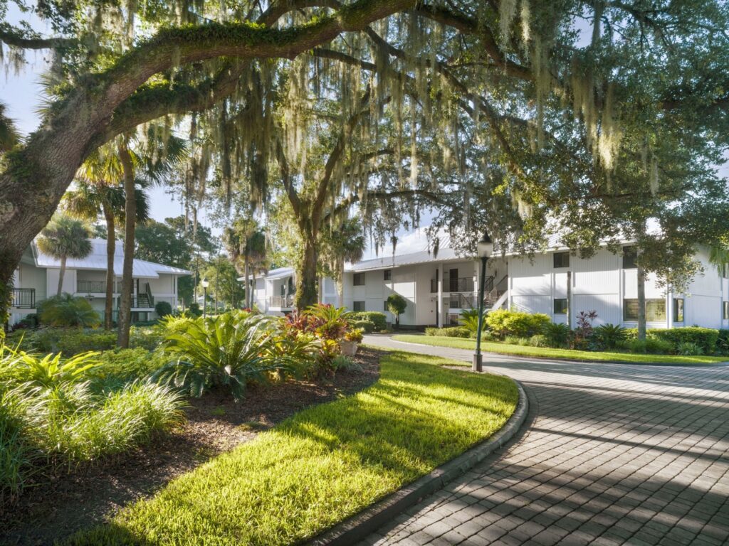 Best Hotels in Tampa Florida: Luxury Suites & Family-Friendly Stays at Saddlebrook Resort 17 Accessible ADA-compliant accommodations at Saddlebrook Resort surrounded by lush tropical landscaping and serene pathways.