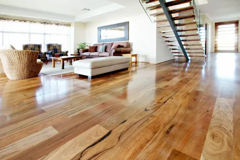 Epoxy Coating Calgary – Radiant Resin Inc 4 Modern living room with sleek, shiny hardwood floors and a contemporary staircase. Protect your beautiful floors with Epoxy Coating Calgary.